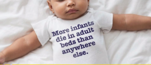 infant in onesie with unsafe sleep message